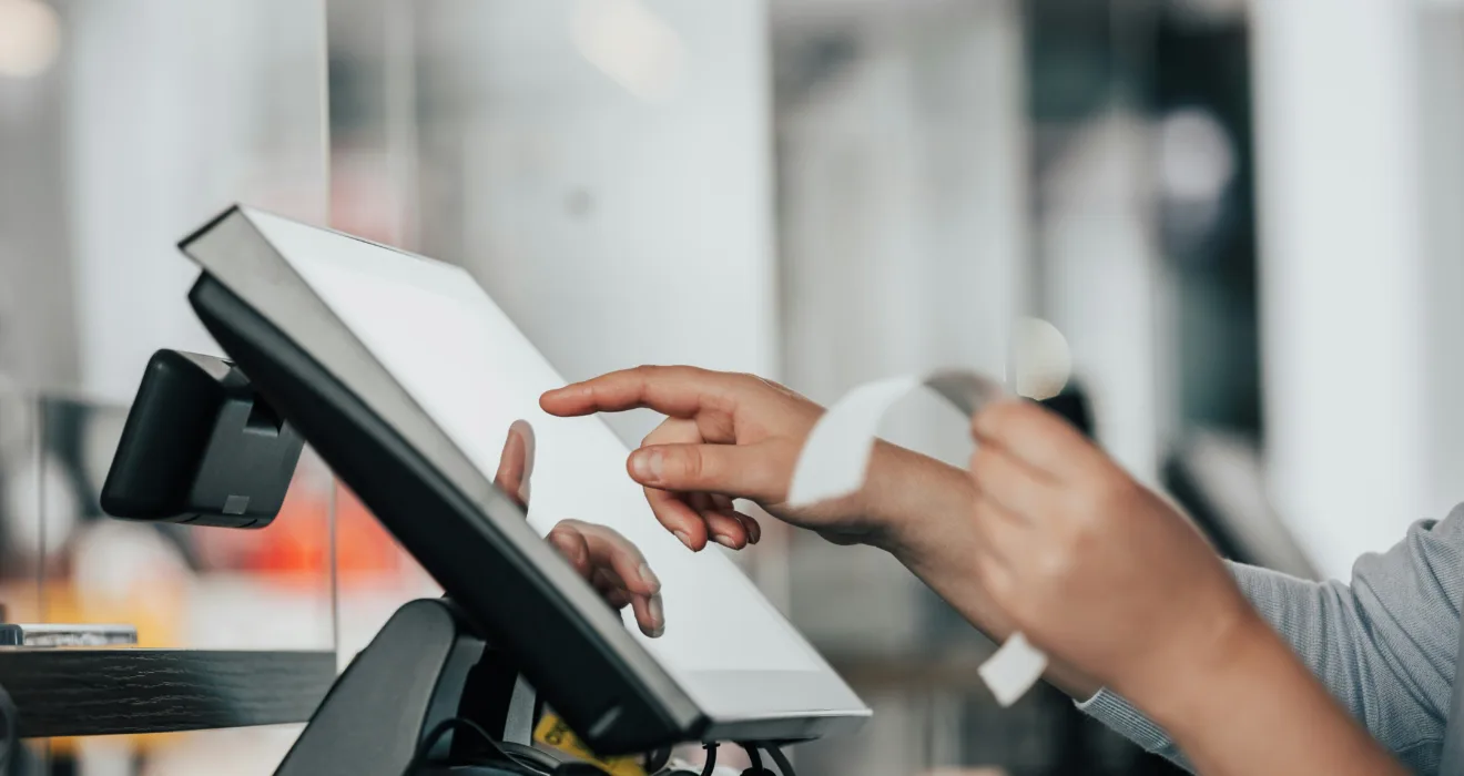 Person at ipad checkout station