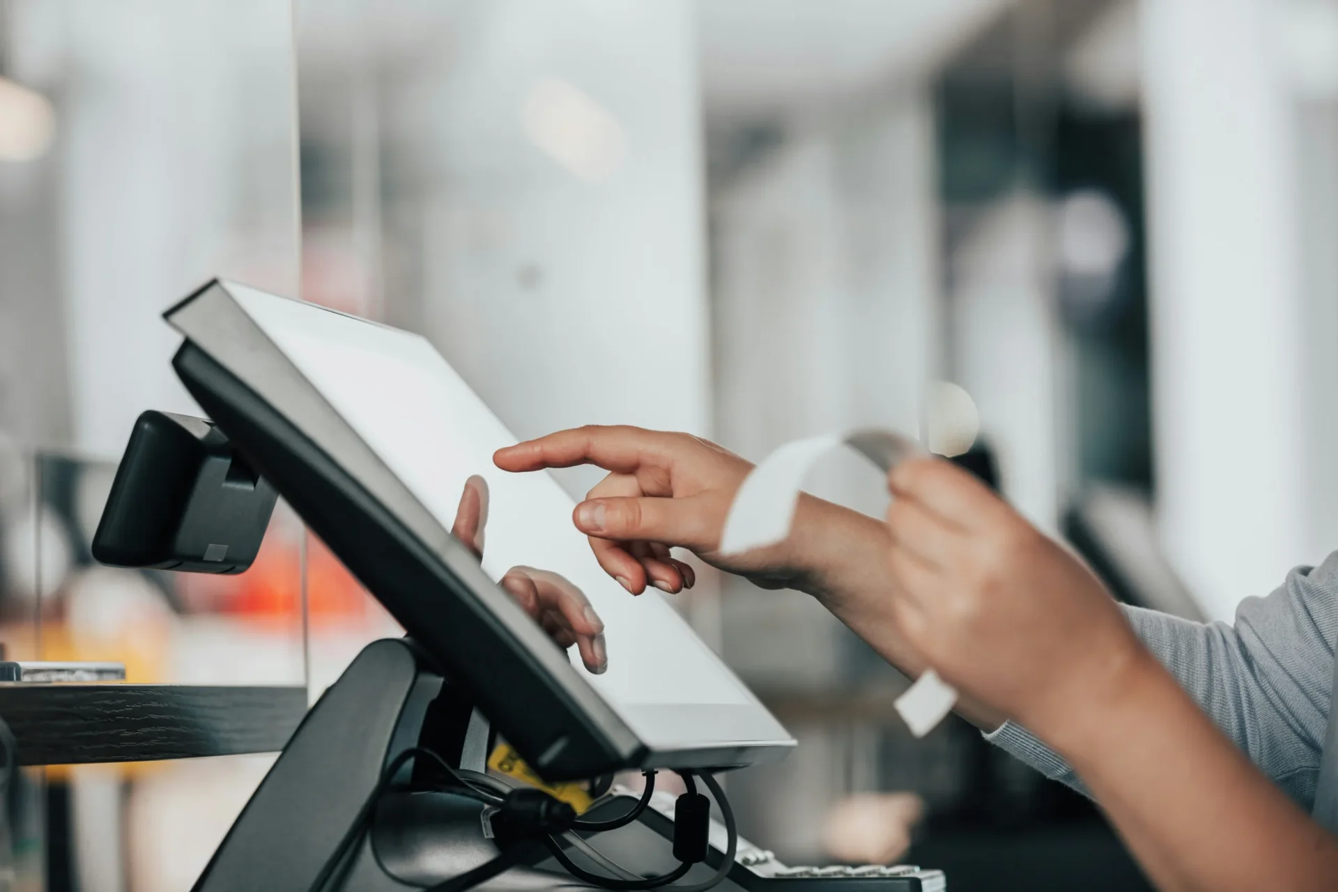 Person at ipad checkout station