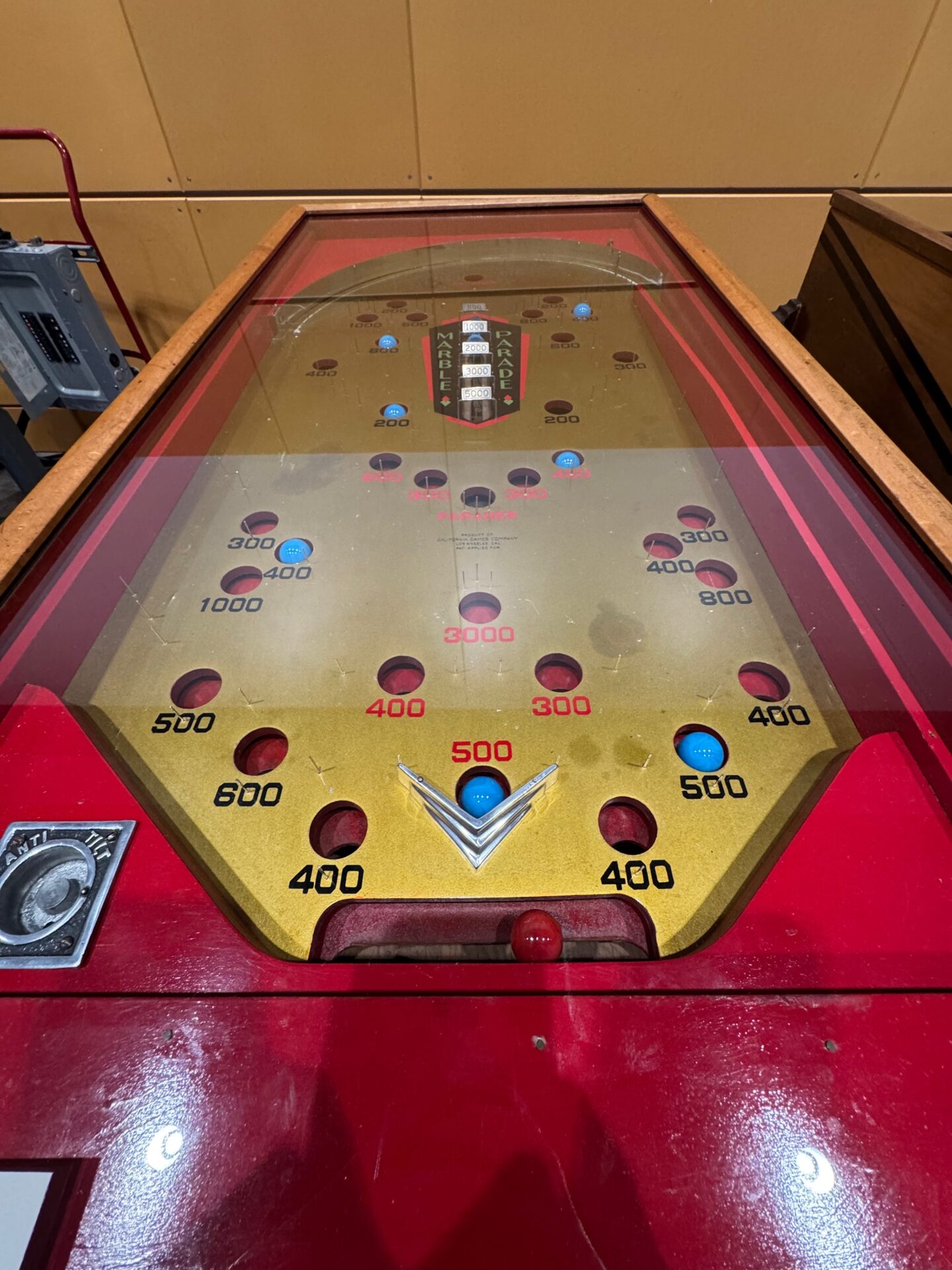An overhead view of a restored California Games "Marble Parade" pinball machine.